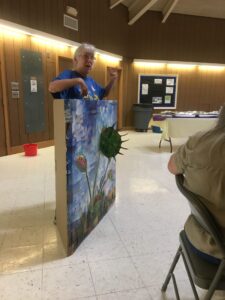 Judith West with her Venus flytrap peek-a-boo display for children at one of the state annual meetings at Hagan Stone Park in Pleasant Garden NC