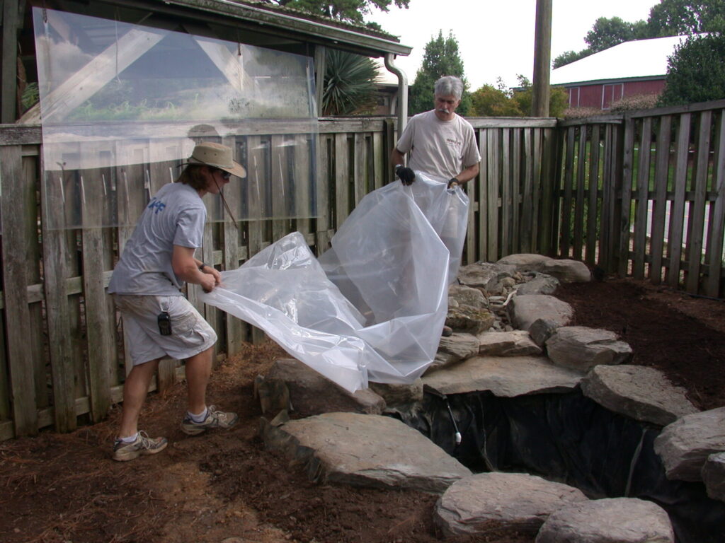 laying plastic to protect the work